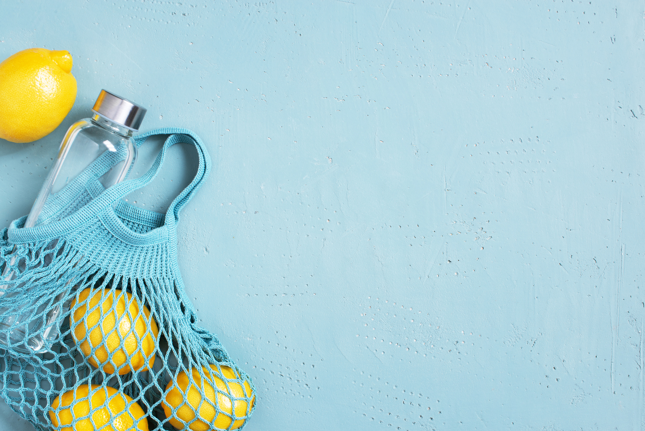 Mesh Bag with Water Bottle and Lemons